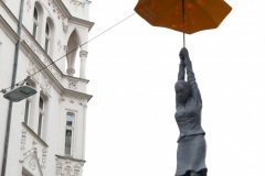 Woman Hanging From an Umbrella